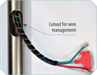 Steel pole with cutots for wire management